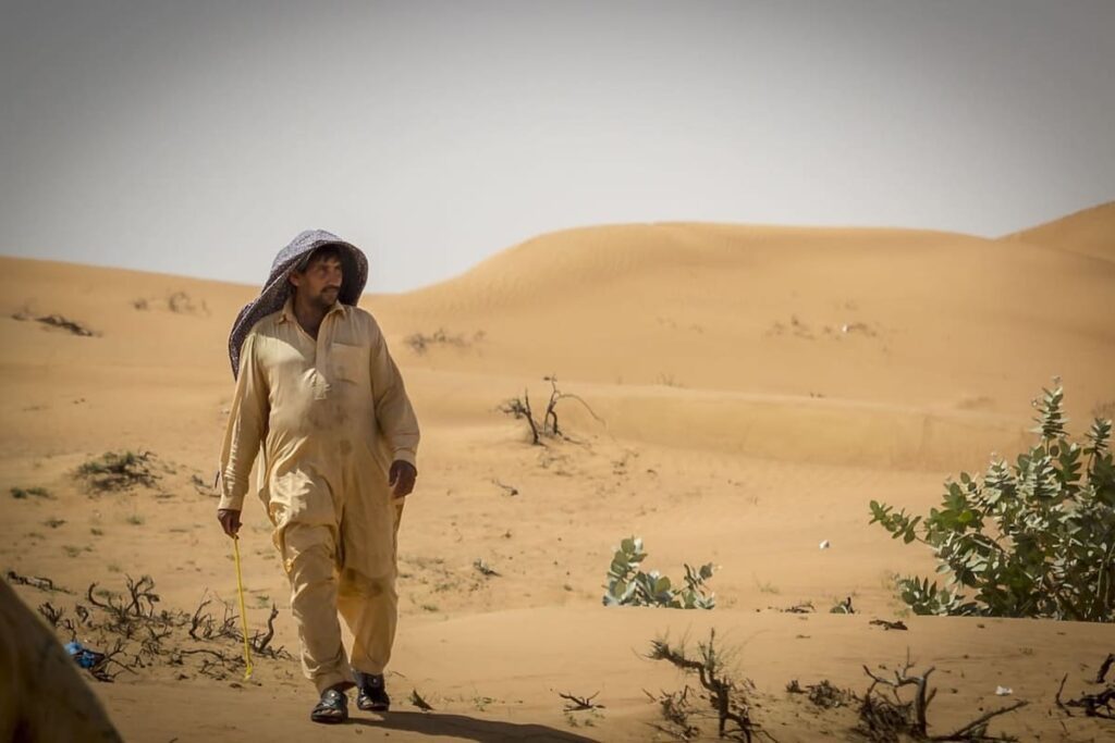 a-bedouin-walking-in-the-desert