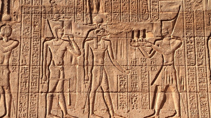 "Detailed hieroglyphs depicting Egyptian deities and rituals."