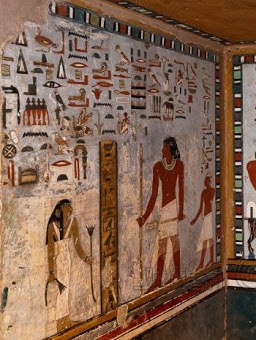 Well-preserved ancient Egyptian tomb paintings with hieroglyphics and figures.