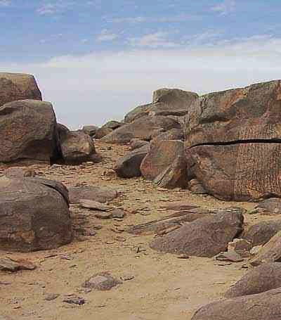 Boulders and ancient inscriptions mark the rugged landscape of Sehel Island.