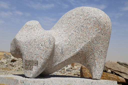A modern granite sculpture of a lion, symbolizing power, on Sehel Island.