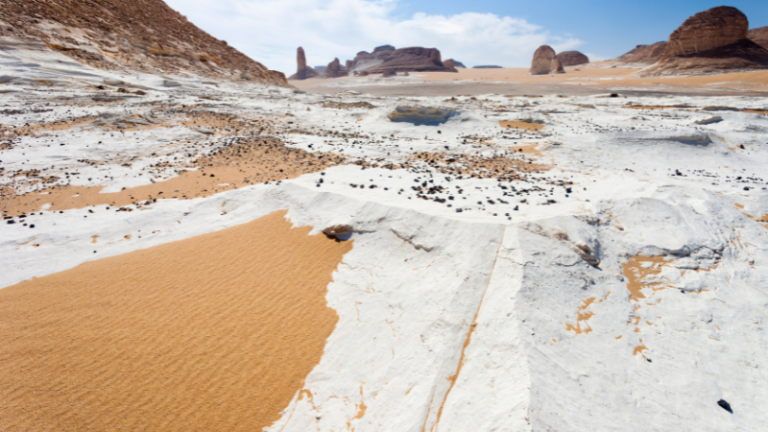 Chalk formations and sand dunes in the White Desert, Egypt.
