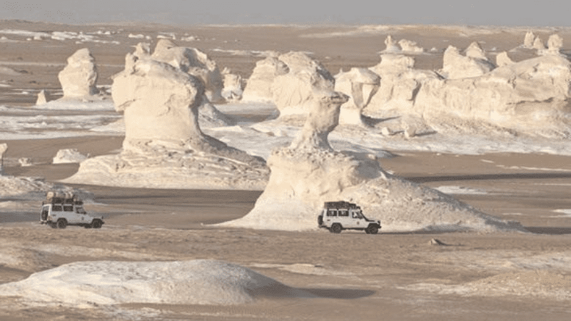 Safari vehicles in the White Desert, Egypt.