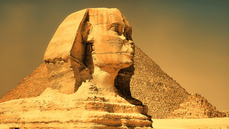 Profile of the Sphinx with the Great Pyramid in the background