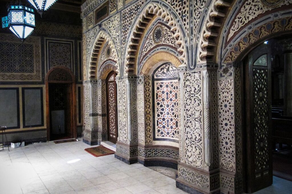 Ornate Islamic architecture interior with intricate patterns.