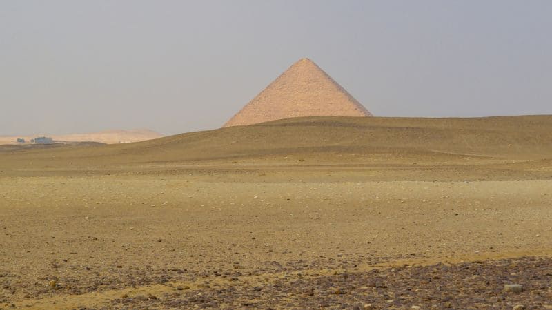 Lone view of the Great Pyramid of Khufu in the Giza plateau desert.