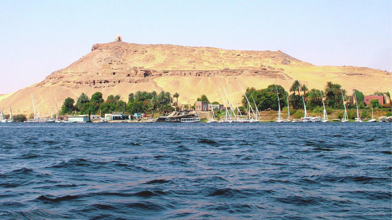A view from the Nile River showing the mountain with the Mausoleum of Aga Khan