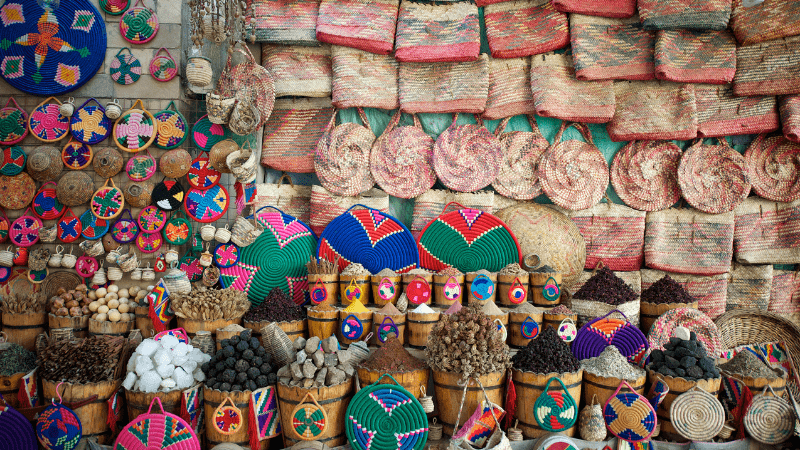 An array of vibrant, handcrafted goods displayed at a traditional market.
