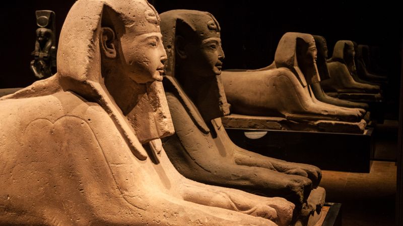 Pharaoh statues in a museum display.