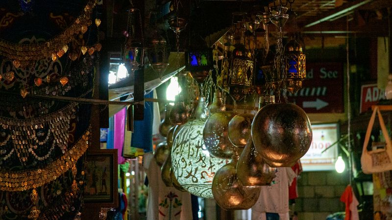 "Intricate lanterns and crafts displayed in an Egyptian souk."