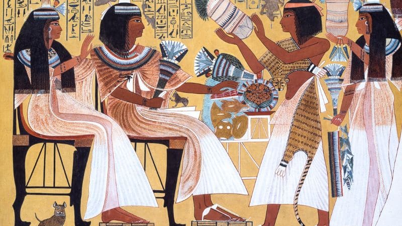 Vibrant ancient Egyptian mural depicting traditional life and offerings.