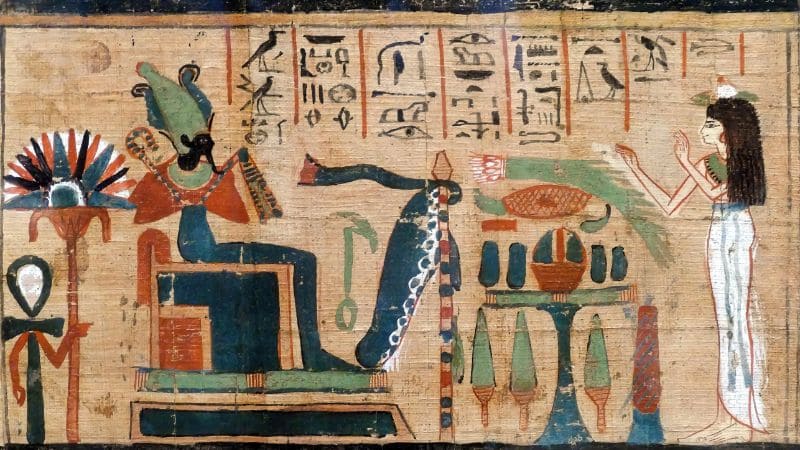 Ancient Egyptian painting with gods and hieroglyphs.