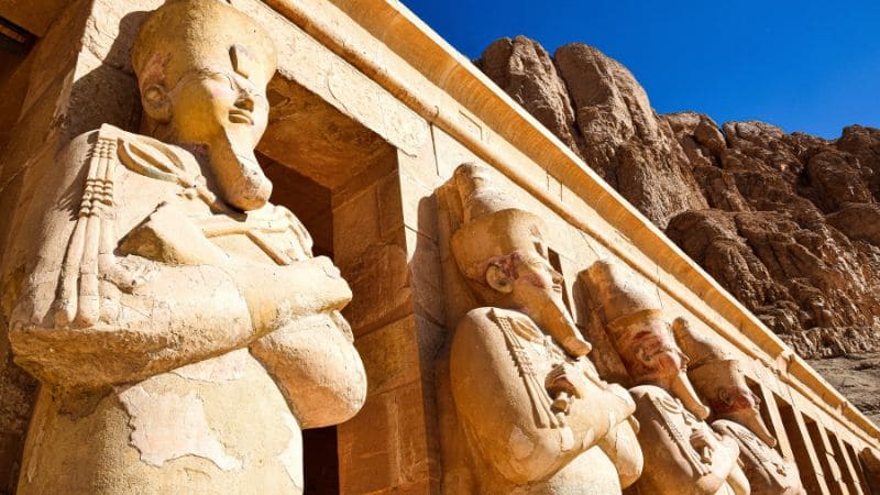 Statues of Queen Hatshepsut at her temple in Egypt.