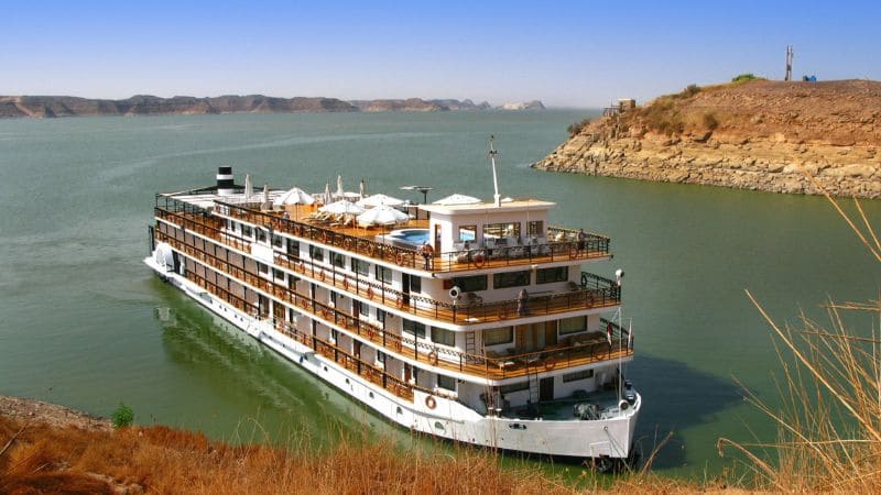 A luxury cruise ship docked on the Nile River.