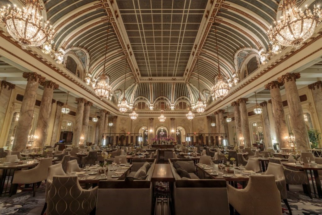 Luxurious interior of a historic hotel in Egypt, featuring ornate decor, rich textiles, and classic architectural details