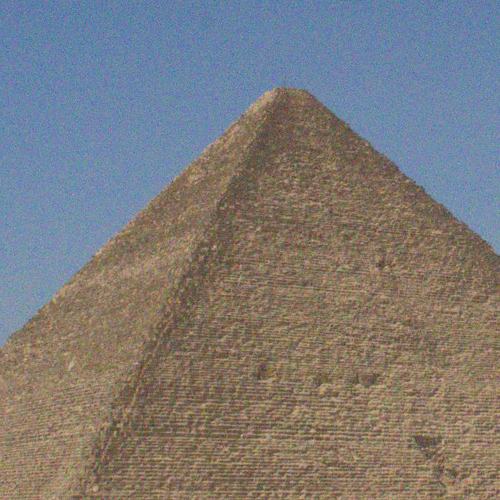 Close-up of the top of the Great Pyramid of Giza against a clear sky