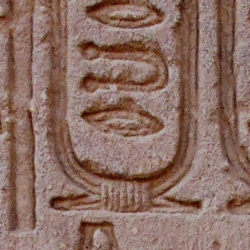 Close-up of an ancient carved stone hieroglyph