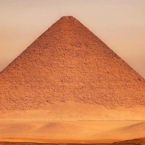 The Red Pyramid of Egypt basking in the warm glow of sunset