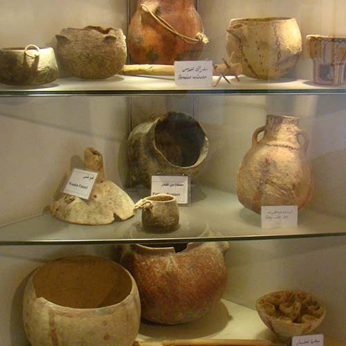 Display of ancient pottery in a museum exhibit