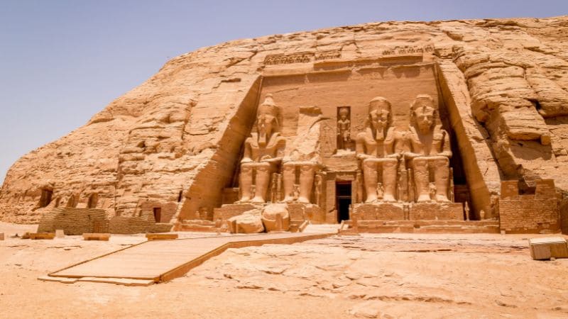 The Great Temple of Abu Simbel with four seated statues in front.