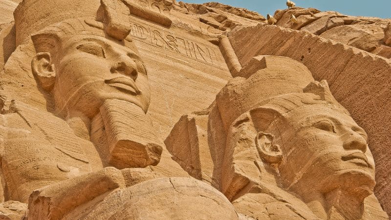 Close-up of colossal carved faces on the facade of Abu Simbel