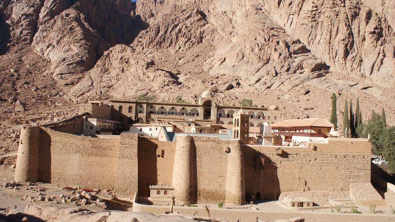 View of St. Catherine's Monastery at the foot of rugged mountains in Sinai, Egypt.