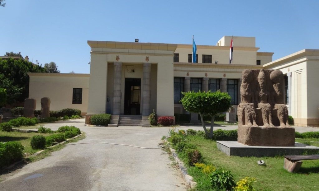 Front view of Kafr El-Sheikh Museum in Egypt, displaying ancient statues in the garden and the main entrance