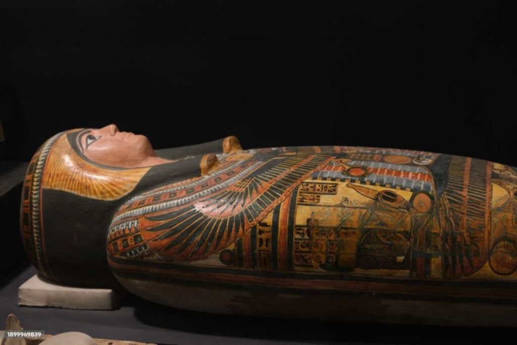 Ancient Egyptian mummy of a noble with intricate wrappings and artifacts