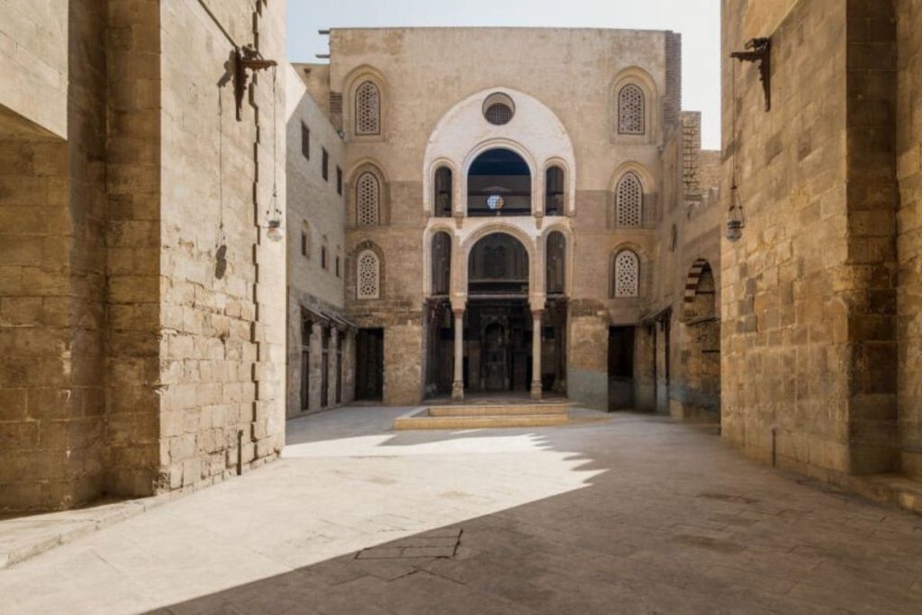Spacious courtyard in historic Cairo with traditional architecture and intricate designs