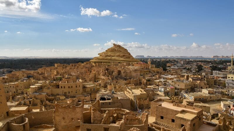 Panoramic view of the ancient city of Shali in Siwa Oasis with a hilltop fortress