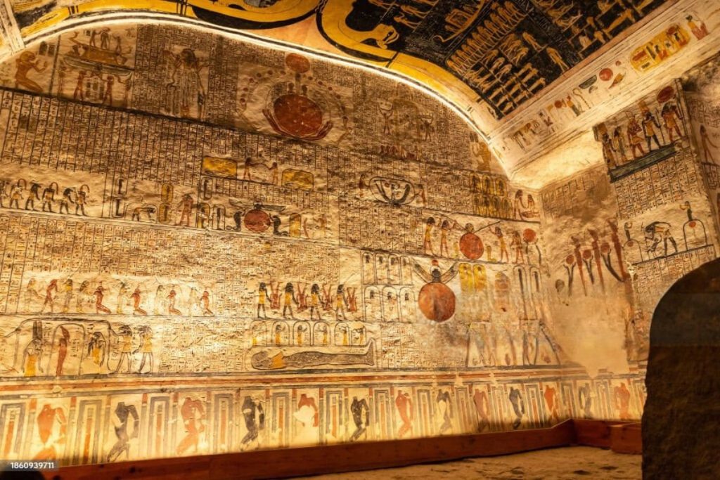 Intricately decorated interior of the Tomb of King Ramses III with ancient Egyptian hieroglyphs and carvings