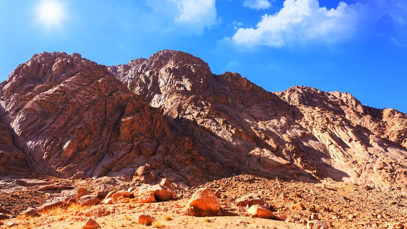 Majestic rocky mountains under a bright blue sky