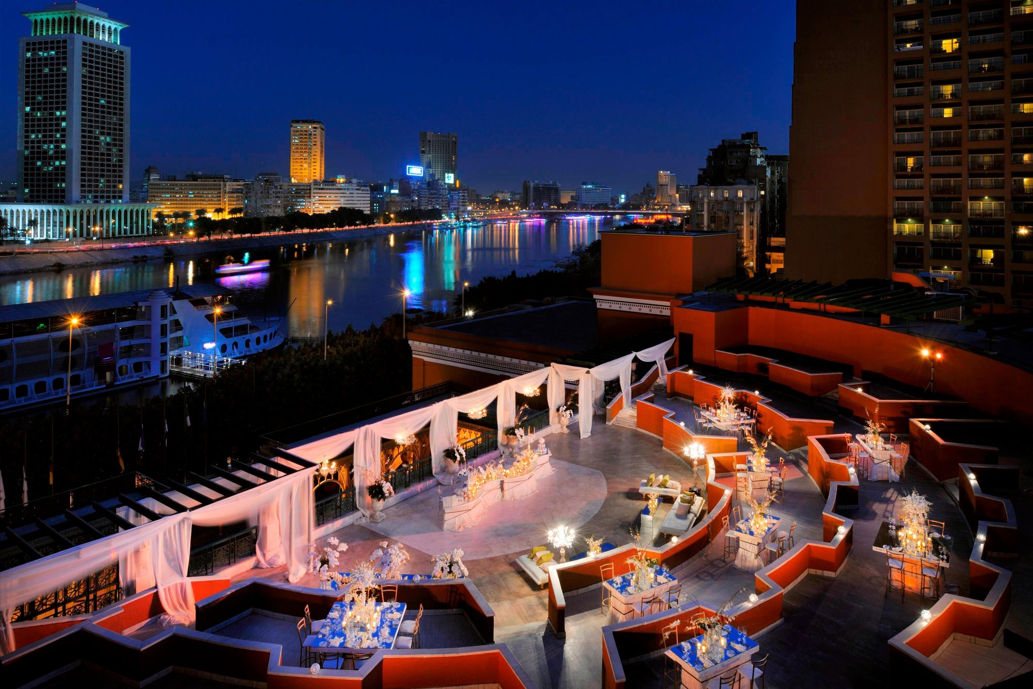 Cairo Marriott Hotel and Casino with a luxurious pool area and lush garden surroundings