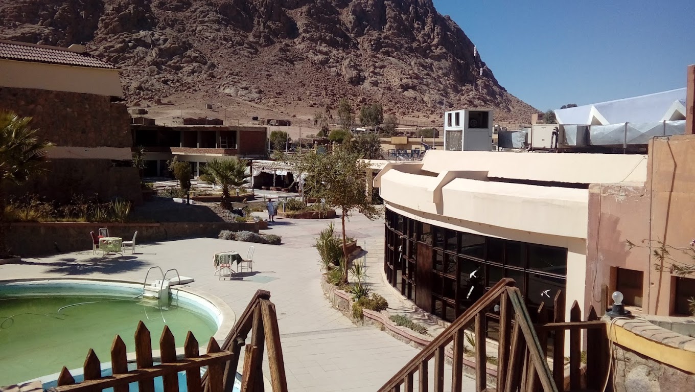 Catherine Plaza Hotel courtyard with a central fountain and surrounding buildings