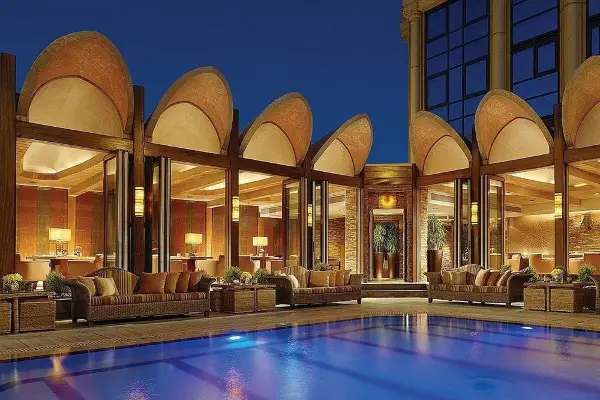 Four Seasons Hotel Cairo at The First Residence with a luxurious pool area and city views