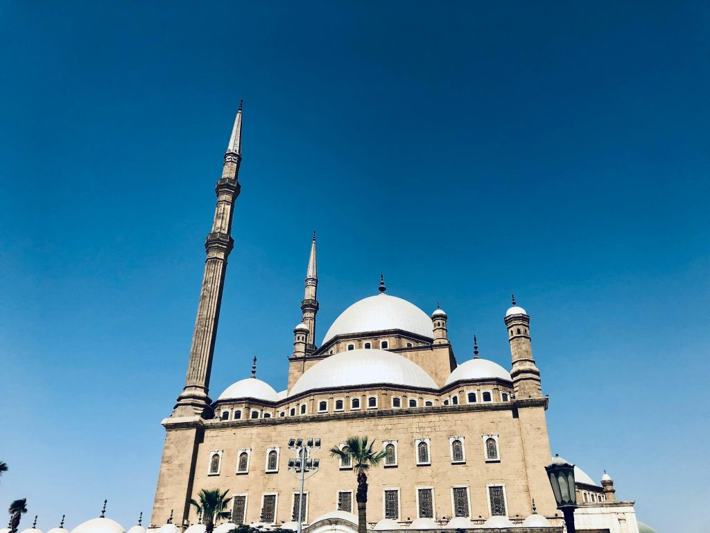 A striking view of the Muhammad Ali Mosque in Cairo under a clear blue sky