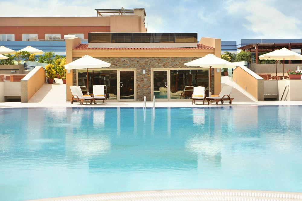 Hilton Alexandria Green Plaza Hotel with modern design and outdoor pool area