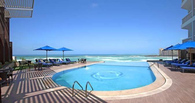 Hilton Alexandria Hotel with a luxurious pool area and city views