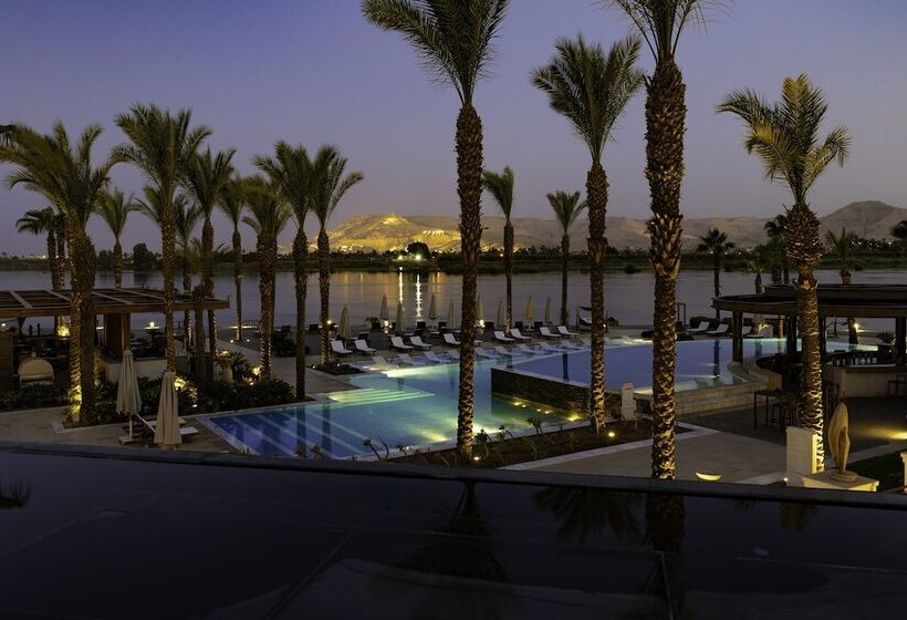 Hilton Luxor Resort with a luxurious pool area and lush surroundings