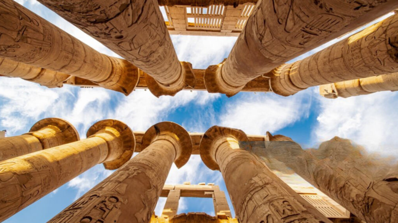 Upward view of the towering columns in the Hypostyle Hall at Karnak Temple