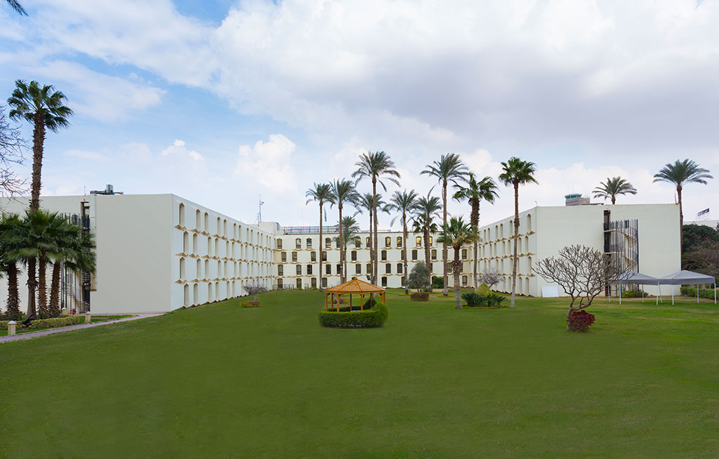 Le Passage Cairo Hotel with a luxurious pool area and beautifully landscaped gardens