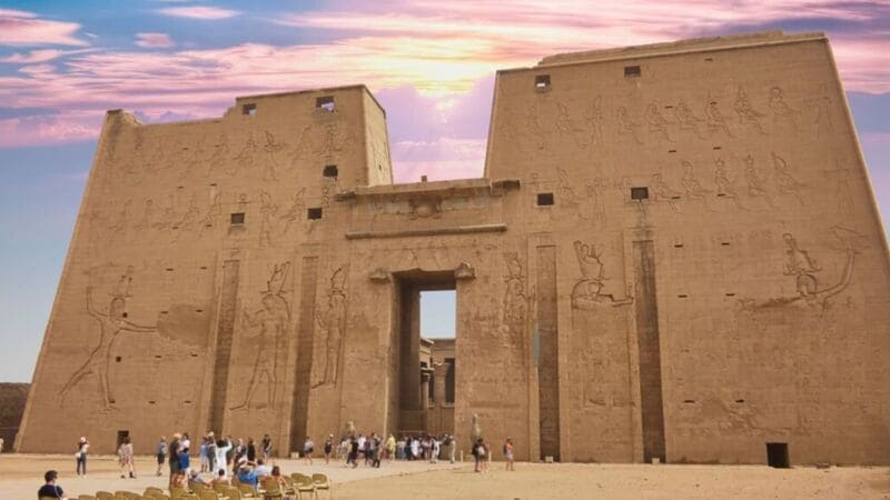 Majestic view of the ancient temples of Luxor, Egypt, illuminated against a twilight sky