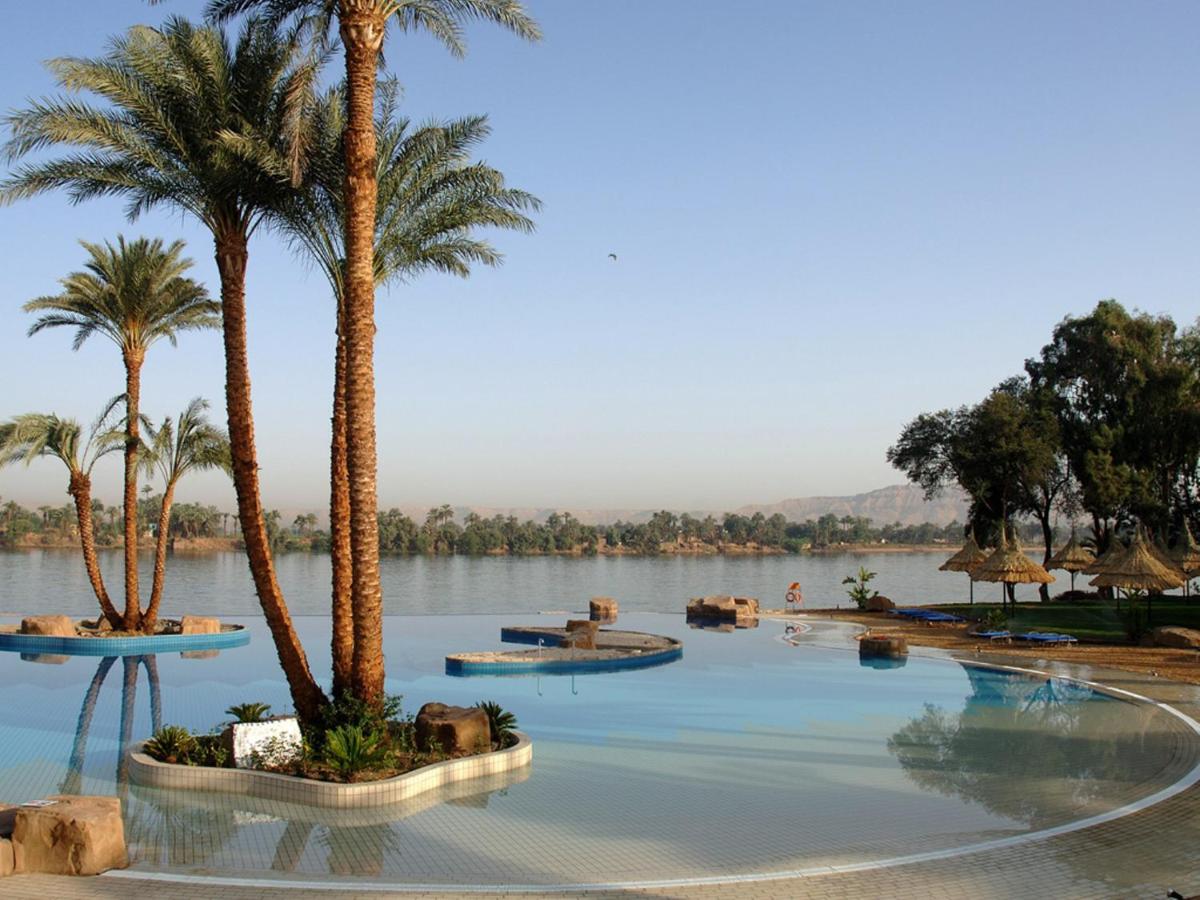 Maritim Jolie Ville Kings Island Hotel in Luxor with a luxurious pool area and palm trees