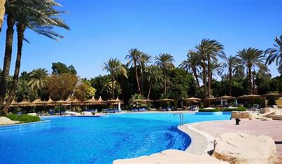 Maritim Jolie Ville Kings Island Hotel in Luxor with a luxurious pool area and lush surroundings