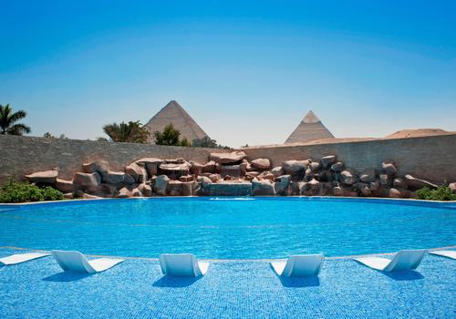 Pyramids Hotel and Spa in Cairo with a view of the pyramids and luxurious amenities.