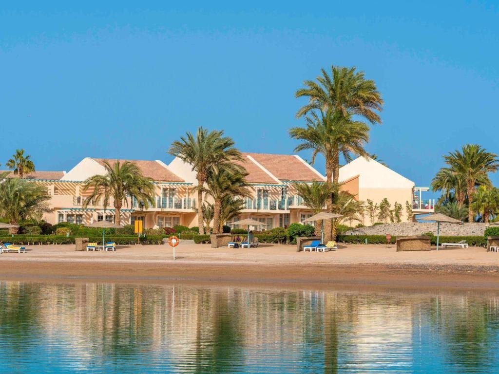 Sunrise Crystal Bay Resort, a luxurious beachfront resort in Hurghada, Egypt, featuring modern design, palm-lined pools, and Red Sea views