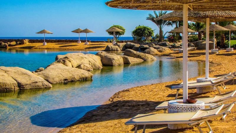 Four Seasons Resort Sharm El Sheikh, a luxury beachfront resort in Egypt with elegant villas, lush gardens, and panoramic Red Sea views