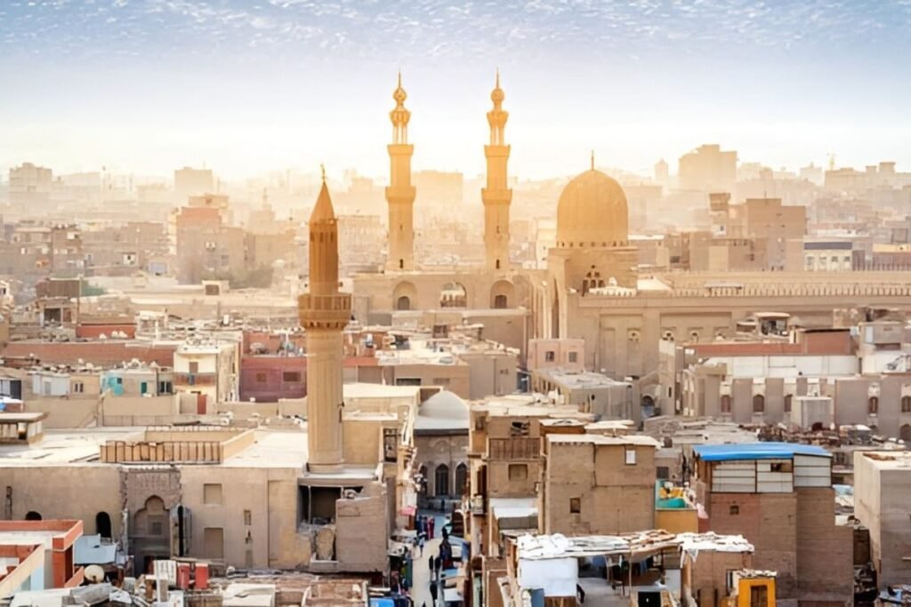 skyline of islamic cairo with historic mosques at sunrise