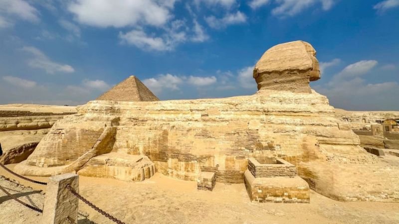 Great Sphinx of Giza with pyramid in background