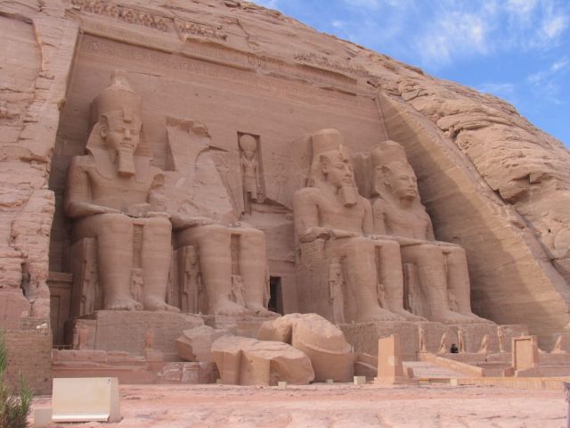 Partial view of the Abu Simbel temple with its colossal statues partly in ruins.